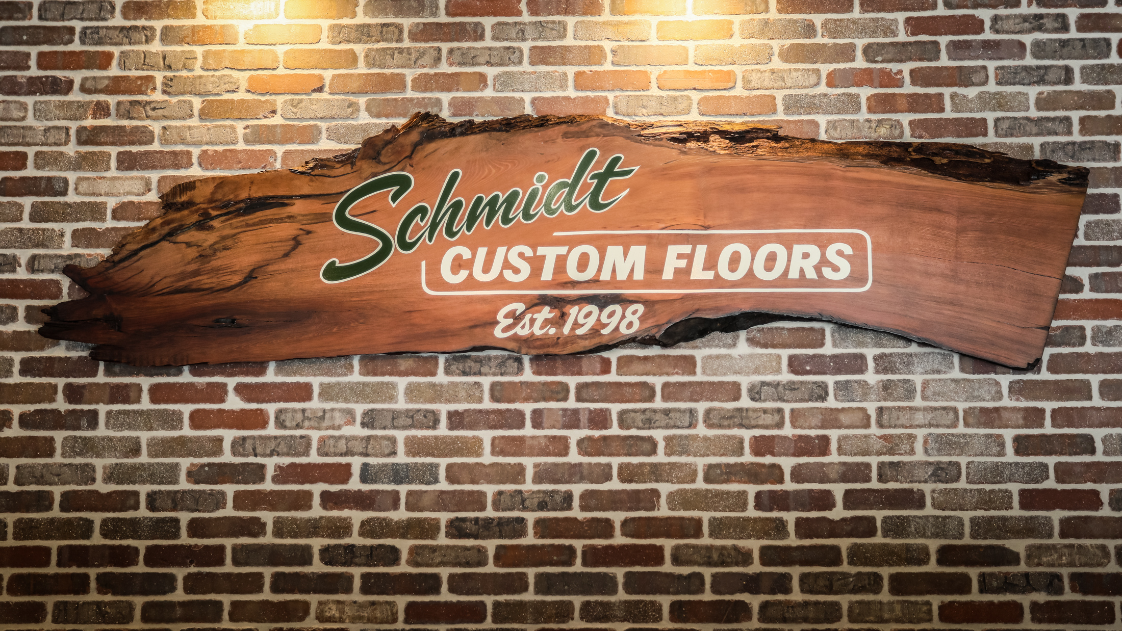 Live-edge Schmidt Custom Floors sign